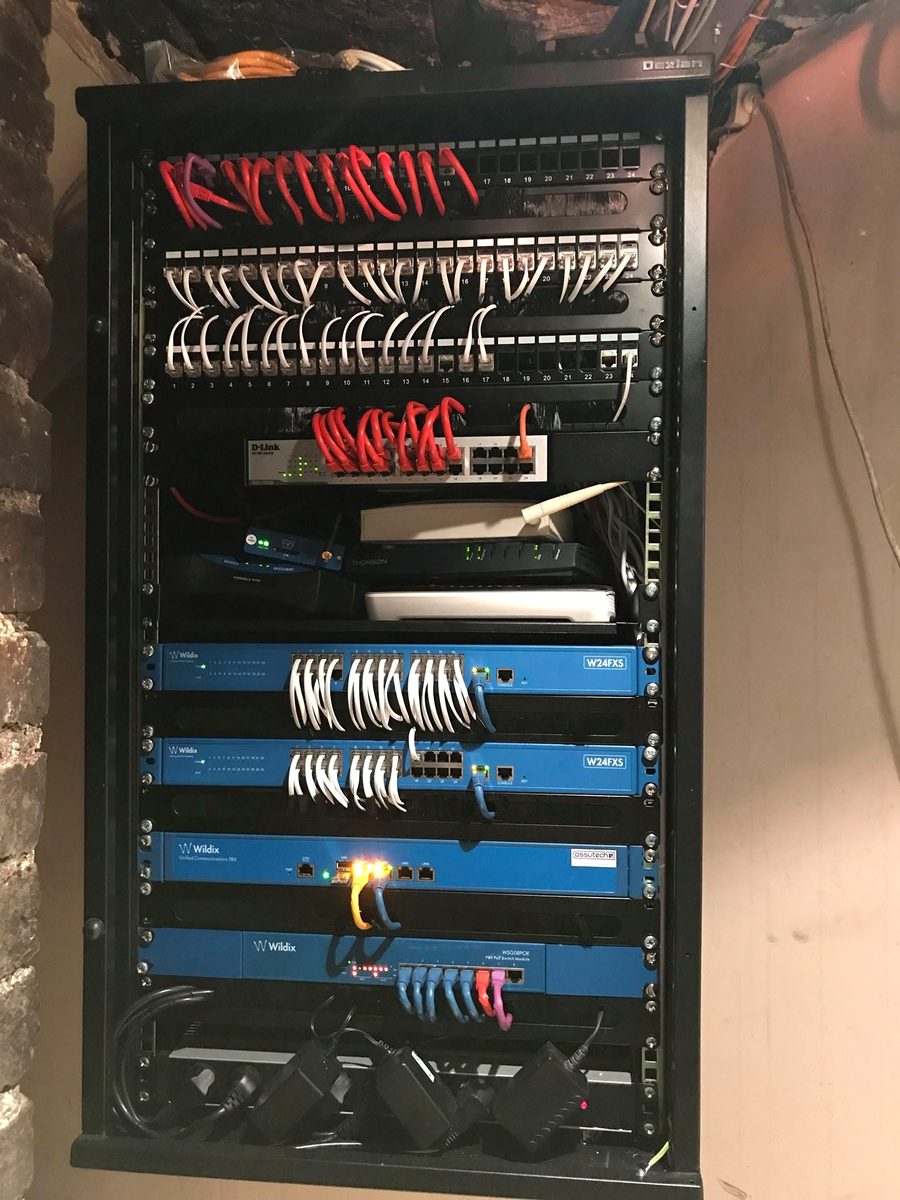 Patch cabinet with Cat 6 panels, switch and telephony gateways